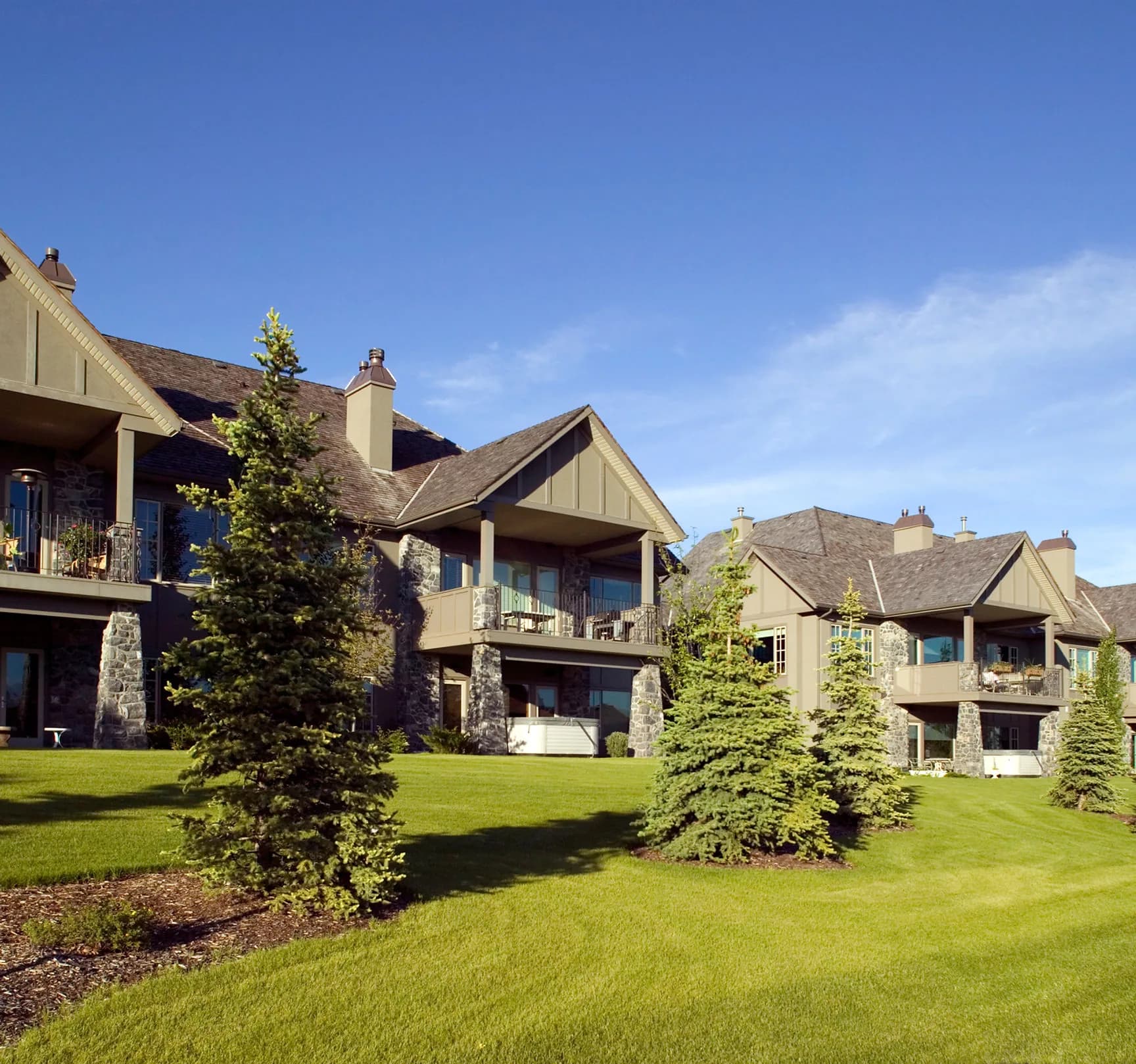 A row of residential investment properties on landscaped grounds